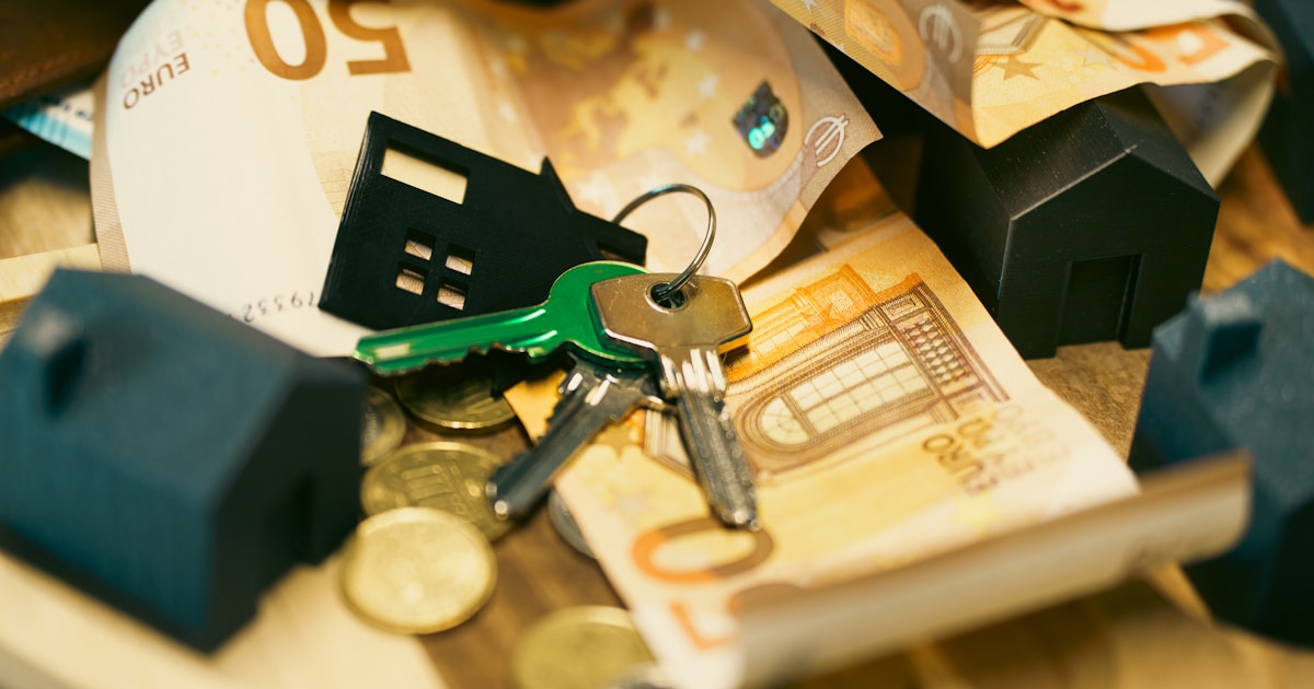 Miniature houses, keys and Australian-style property finance paperwork