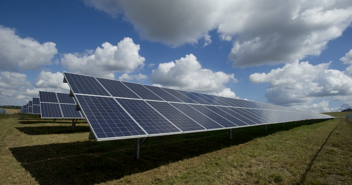 Solar panels on a residential rooftop with blue sky